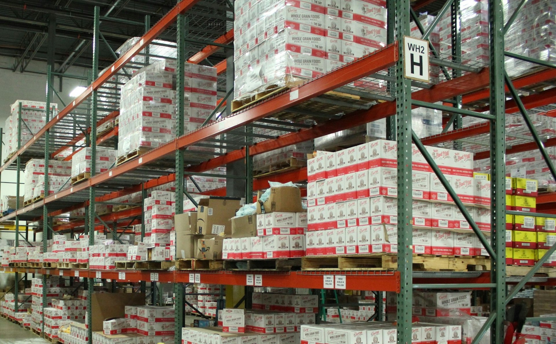 white and red cardboard boxes on shelf